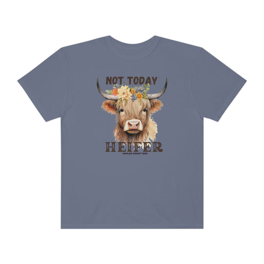 A whimsical t-shirt featuring a cow adorned with flowers, embodying a playful cartoon style. Made of 100% ring-spun cotton, garment-dyed for extra softness and durability. Perfect for a relaxed, cozy daily look.