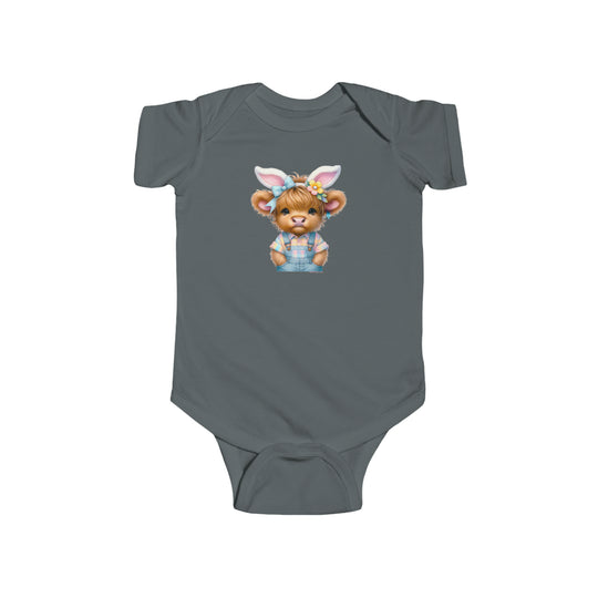 A grey baby bodysuit featuring a cartoon cow with bunny ears, perfect for Easter. Made of 100% cotton, with ribbed knit bindings and plastic snaps for easy changing. From Worlds Worst Tees.