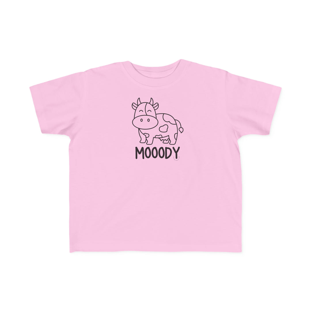 Moody Toddler Tee: A pink shirt featuring a cow print, ideal for sensitive toddler skin. Made of 100% combed ringspun cotton, light fabric, with a classic fit and tear-away label. Sizes: 2T, 3T, 4T, 5-6T.