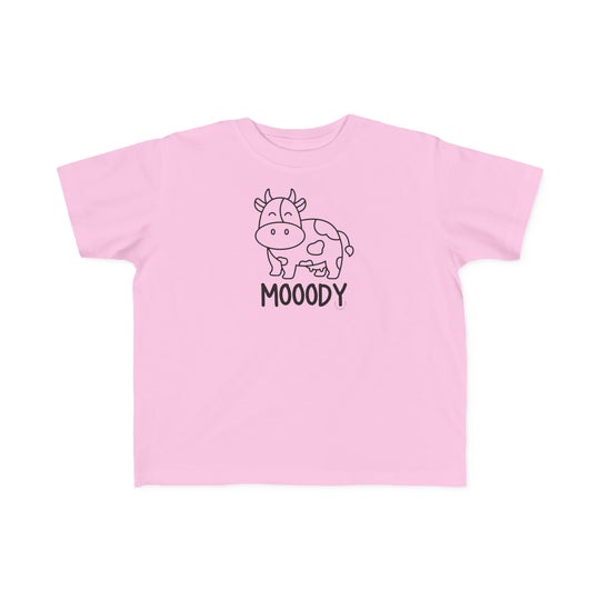 Moody Toddler Tee: A pink shirt featuring a cow print, ideal for sensitive toddler skin. Made of 100% combed ringspun cotton, light fabric, with a classic fit and tear-away label. Sizes: 2T, 3T, 4T, 5-6T.