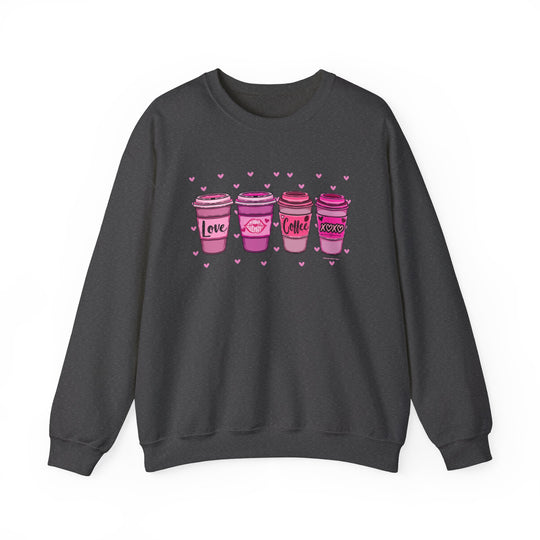 Unisex XOXO Coffee Crew sweatshirt, featuring pink coffee cups. 50% cotton, 50% polyester blend, ribbed knit collar, loose fit, and no itchy side seams. Medium-heavy fabric, sewn-in label. Sizes S-5XL.