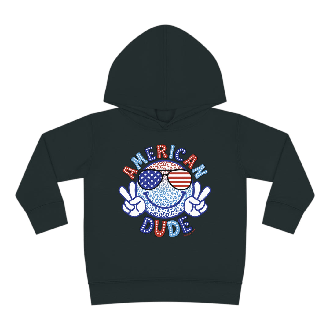 American Dude Toddler Hoodie featuring a smiley face with sunglasses cartoon design. Jersey-lined hood, cover-stitched details, and side seam pockets for comfort and durability. Ideal for cozy playtime.