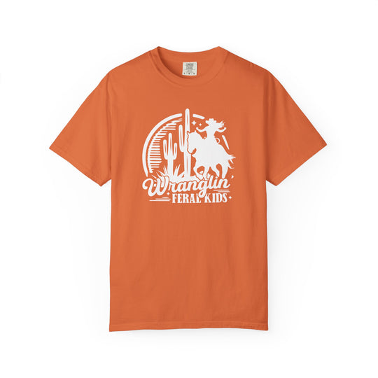 Wranglin’ Feral Kids Tee features a Western-themed graphic of a youngster on a bucking horse, perfect for adding humor and style to any casual wardrobe.