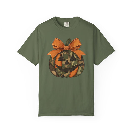 Jackie O Tee: Olive-green short-sleeve with a jack-o-lantern design featuring orange and camouflage segments, topped with a big orange bow, ideal for casual wear.