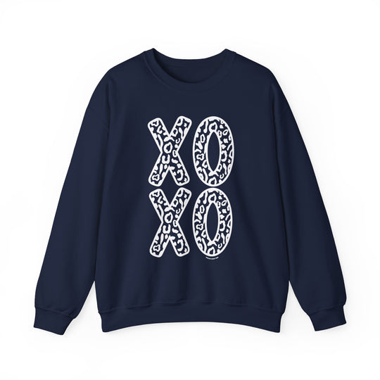 Unisex XOXO Crew sweatshirt in blue with white letters. Comfortable heavy blend fabric, ribbed knit collar, no itchy side seams. Features X and O letters design. Ideal for casual wear.