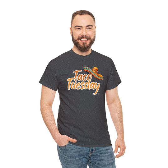 A man in a Taco Tuesday Tee, showcasing a grey shirt with a sombrero. Unisex heavy cotton tee, classic fit, tear-away label, 100% US cotton, ethically made. Casual fashion staple from Worlds Worst Tees.