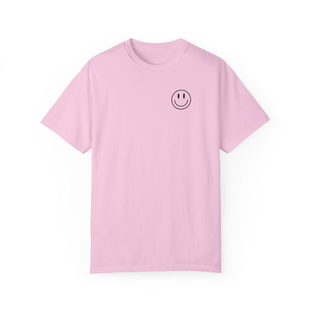 A relaxed fit God Day to Have a Good Day Tee, featuring a smiley face design on a pink t-shirt. Made of 100% ring-spun cotton with double-needle stitching for durability and a cozy feel.