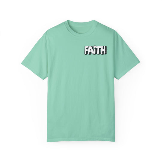 A relaxed fit Walk By Faith Not By Sight Tee in green with white text. 100% ring-spun cotton, garment-dyed for coziness. Double-needle stitching for durability, no side-seams for shape retention.