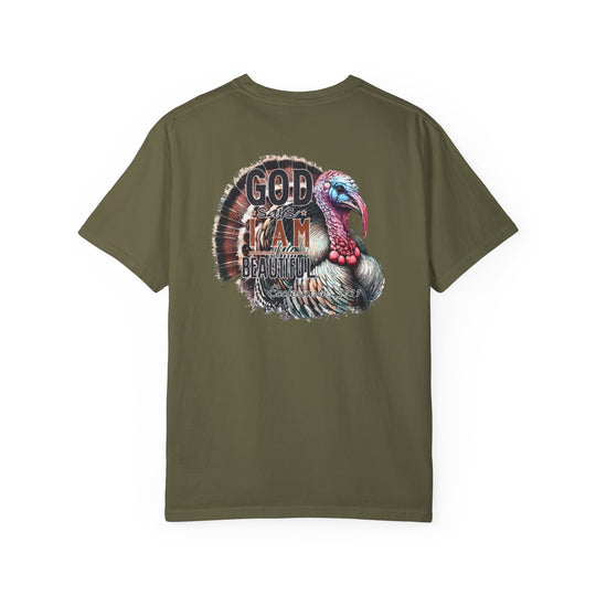 A green tee featuring a turkey design, the I am Beautiful Tee from Worlds Worst Tees. Made of 100% ring-spun cotton, garment-dyed for coziness, with a relaxed fit and durable double-needle stitching.
