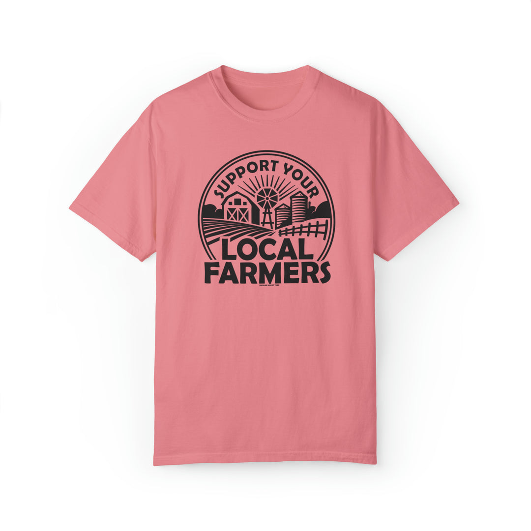 Unisex Support Your Local Farmer Tee, a pink t-shirt with a black logo. Made of 80% ring-spun cotton and 20% polyester, featuring a relaxed fit and rolled-forward shoulder for ultimate comfort and style.