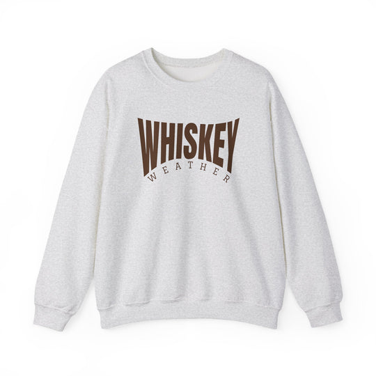 Light-heather gray crewneck sweatshirt with WHISKEY WEATHER in brown text, showcasing a classic fit and cozy blend of polyester and cotton.