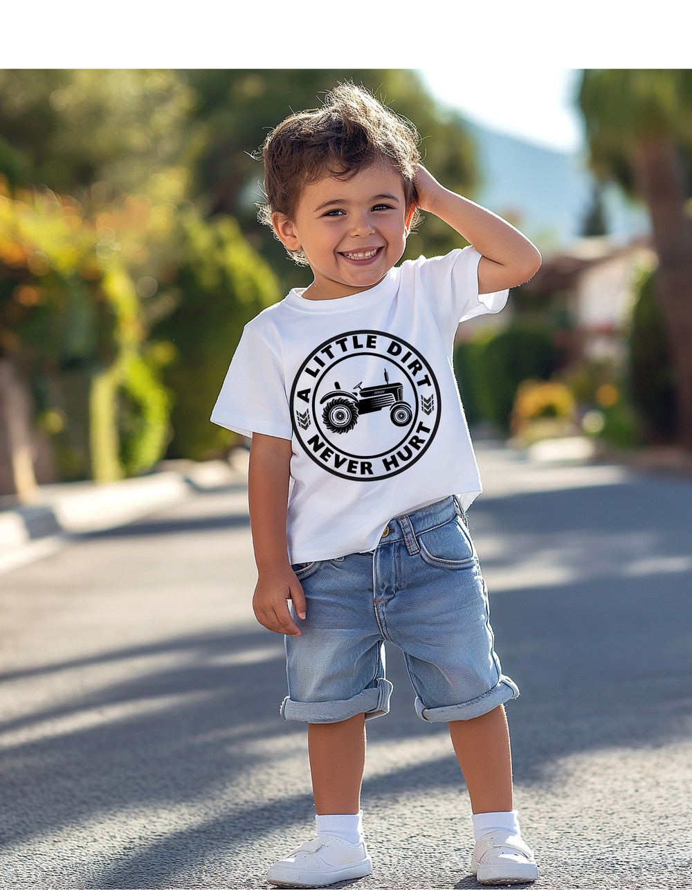 Young boy wearing A Little Dirt Never Hurt Kids Tee with tractor graphic, ideal for active play, crafted from soft combed cotton for comfort in a suburban setting.