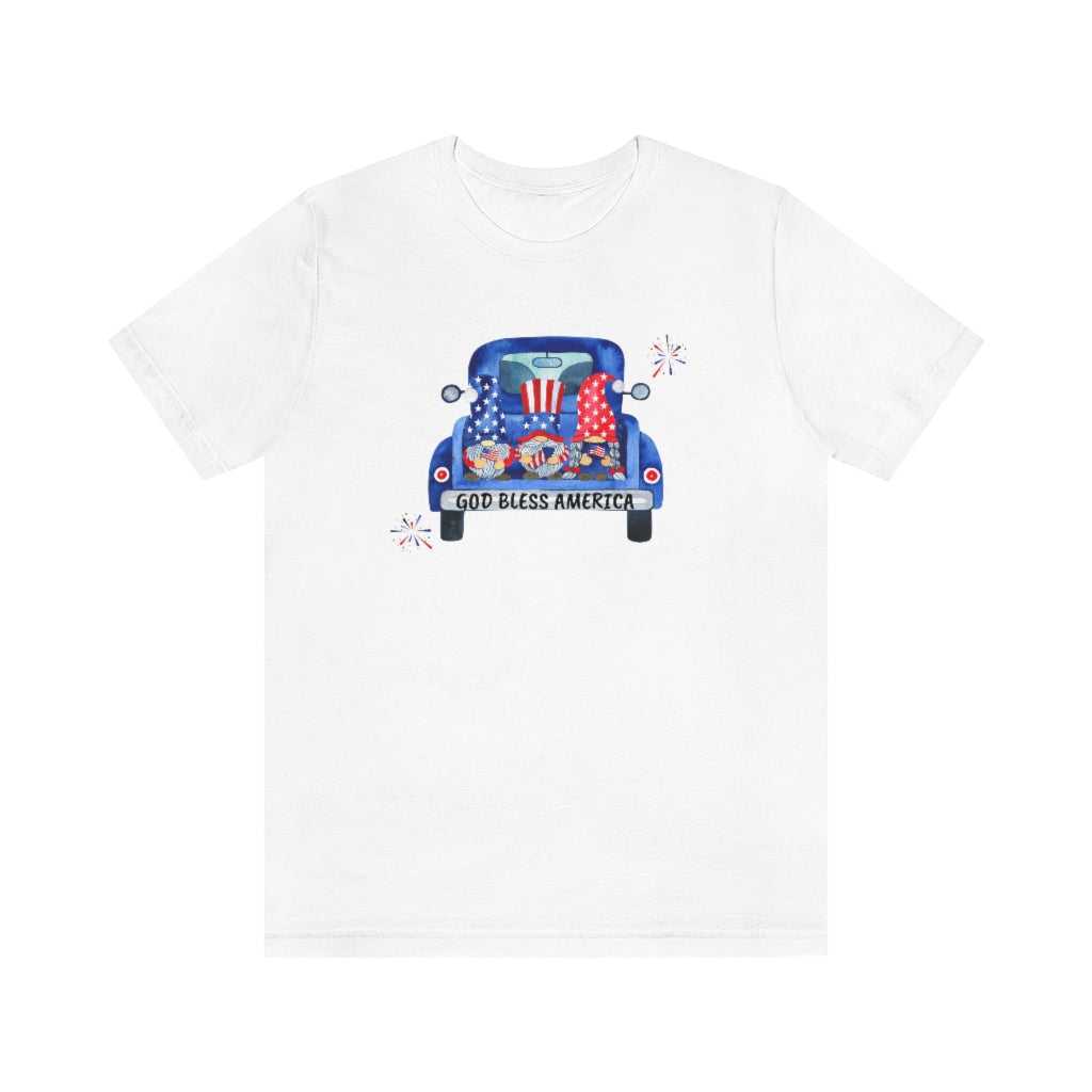 A classic American Gnomies Tee, featuring a white t-shirt with a blue truck and gnomes in a car print. Unisex jersey tee made of 100% cotton, retail fit, with ribbed knit collars and taping on shoulders for durability.