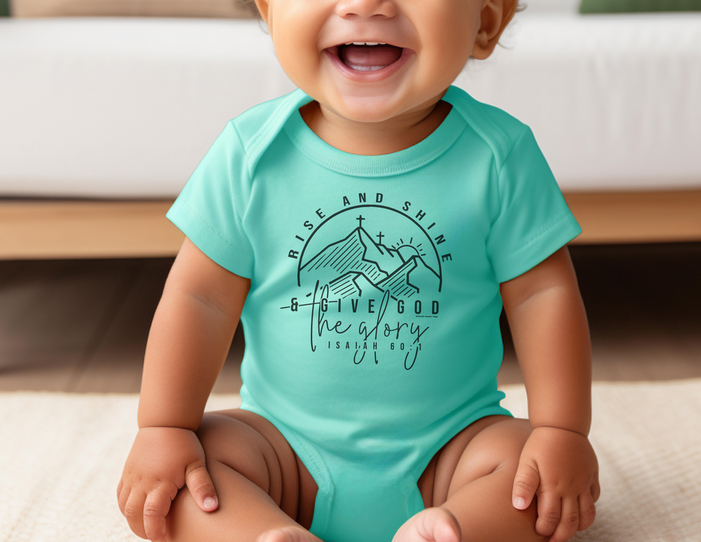 A baby in a fine jersey bodysuit with ribbed knitting for durability. Fabric: 100% cotton (may vary for colors). Plastic snaps at cross closure for easy changing. Rise and Shine Onesie by Worlds Worst Tees.