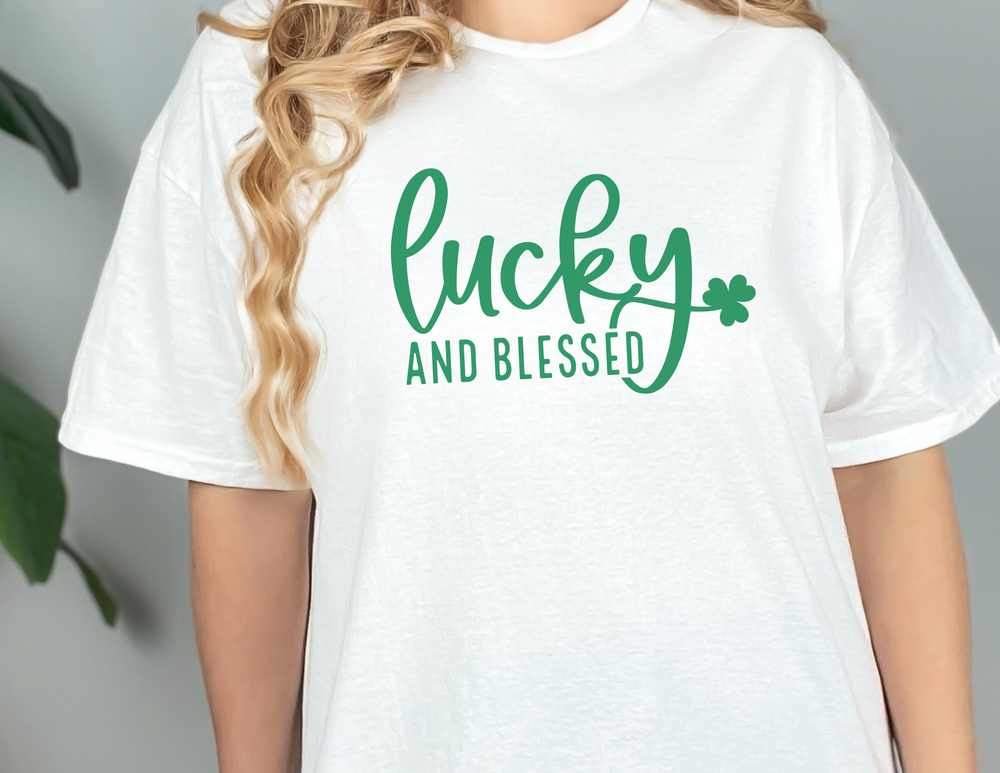 A unisex Lucky and Blessed Tee, featuring a woman in a white shirt. Made of soft cotton with ribbed knit collars and taping on shoulders for a better fit. Retail fit, 100% Airlume combed cotton.