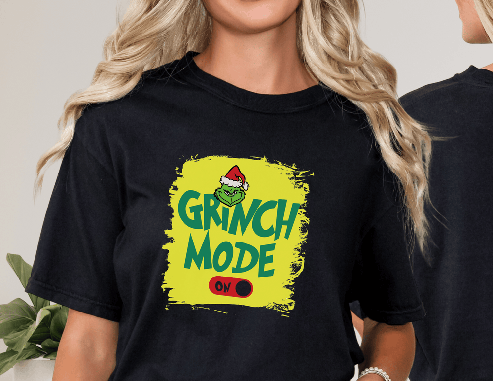 A classic Grinch Mode On Tee in unisex jersey style, featuring soft cotton, ribbed knit collars, and taping for better fit. 100% Airlume combed and ringspun cotton, light fabric, retail fit.