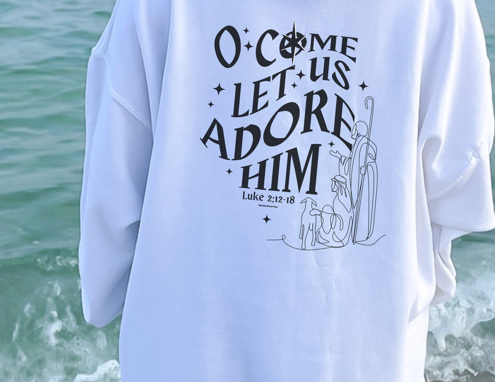 Unisex heavy blend crewneck sweatshirt with a graphic design: O come let us adore him Crew. Comfortable, loose fit, ribbed knit collar, polyester-cotton blend. No itchy side seams. Sewn-in label.