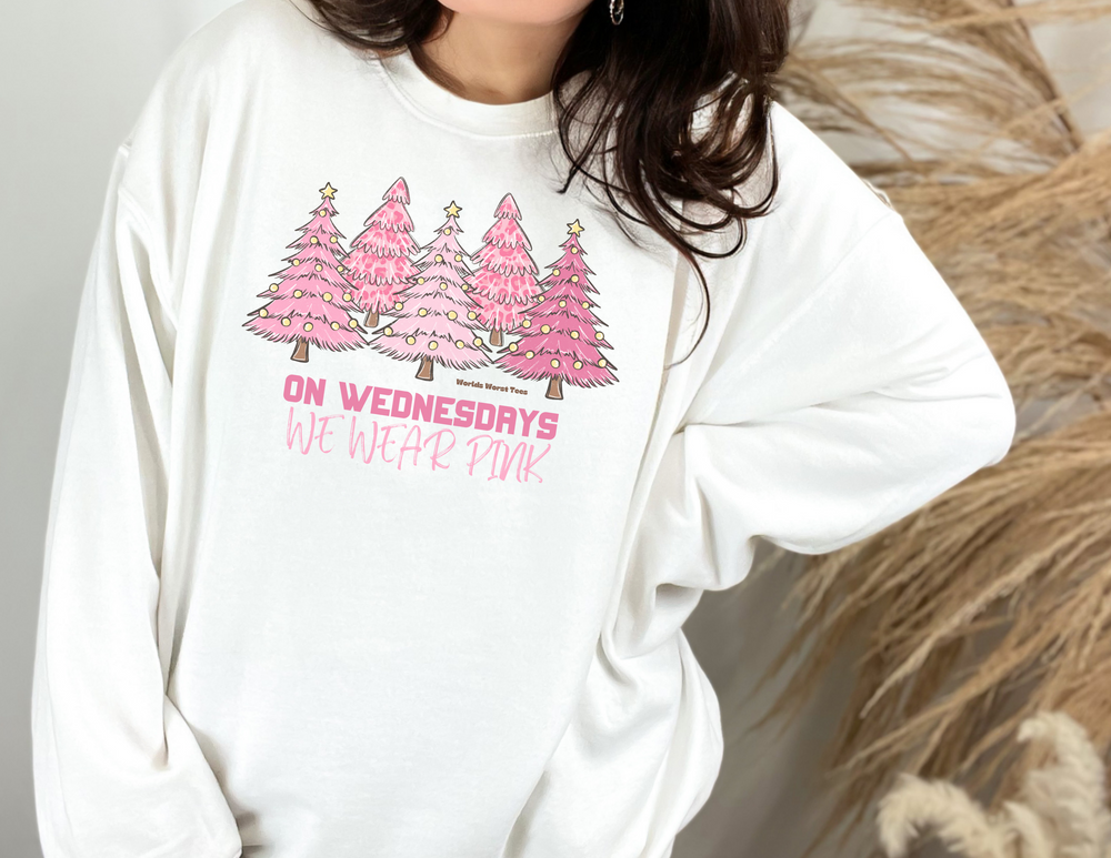 A cozy unisex crewneck sweatshirt featuring a white sweater with pink trees, embodying comfort and style. Ideal for any occasion, with a ribbed knit collar and a blend of polyester and cotton for a fresh look.