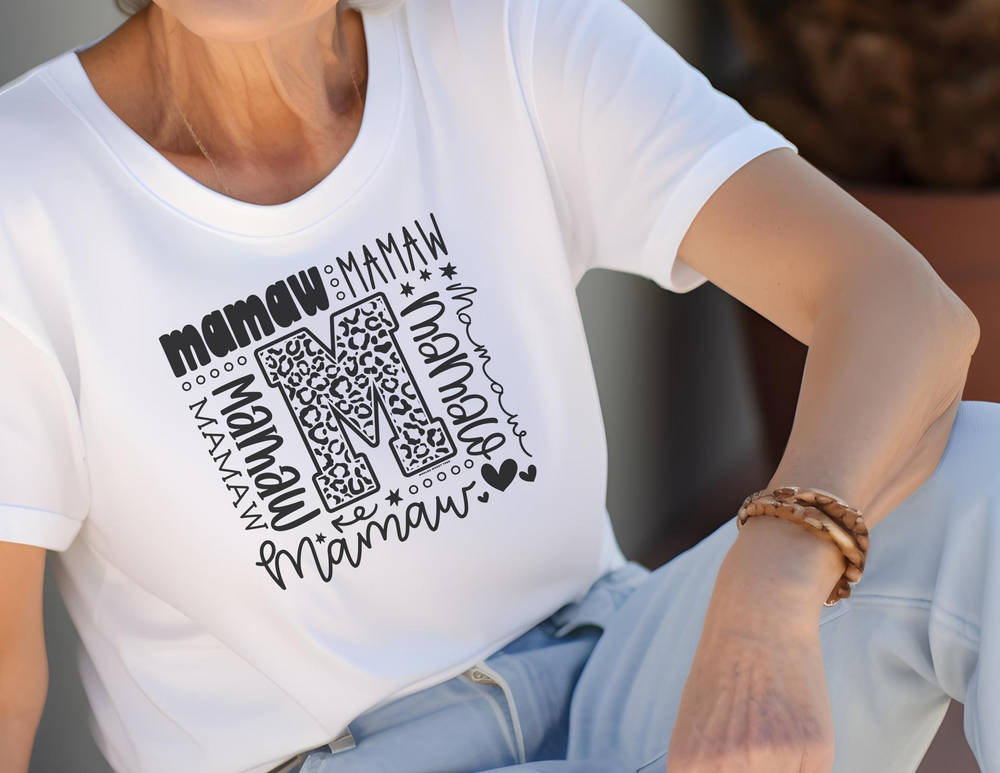 A customizable Mamaw Tee by Comfort Colors, featuring a relaxed fit, ring-spun cotton fabric, and double-needle stitching for durability. Perfect for casual or semi-formal wear.