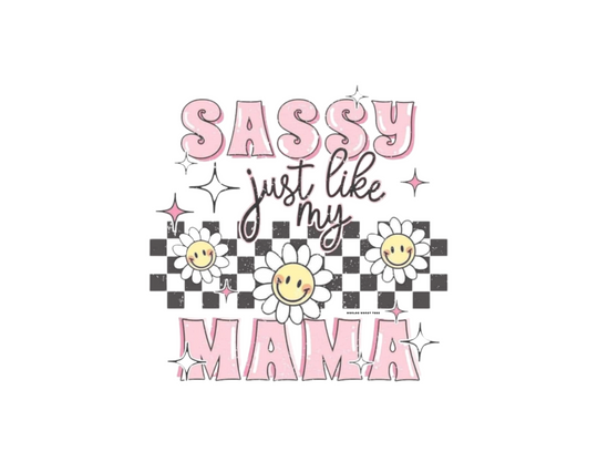 A playful infant fine jersey bodysuit featuring a whimsical design of flowers, stars, and text. Crafted from 100% cotton for durability and comfort. Plastic snaps for easy changing. Title: Sassy like my mama Onesie.