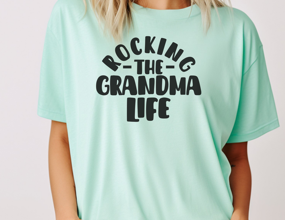 A relaxed fit Rocking the Grandma Life Tee made of 100% ring-spun cotton. Garment-dyed for extra coziness, with double-needle stitching for durability and a seamless design for a tubular shape.