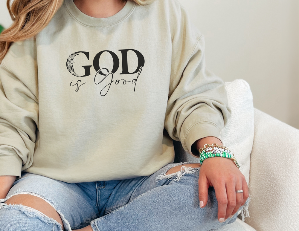 A comfortable unisex heavy blend crewneck sweatshirt featuring the God is Good Crew design. Made of 50% cotton and 50% polyester, with ribbed knit collar and durable double-needle stitching. Ethically crafted with cozy medium-heavy fabric.