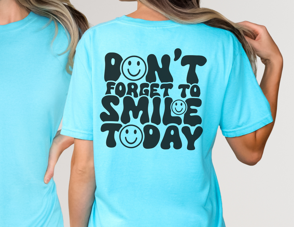 A relaxed fit Don't Forget To Smile Today Tee, crafted from 100% ring-spun cotton. Garment-dyed for extra coziness, featuring double-needle stitching for durability and a seamless design for a tubular shape.