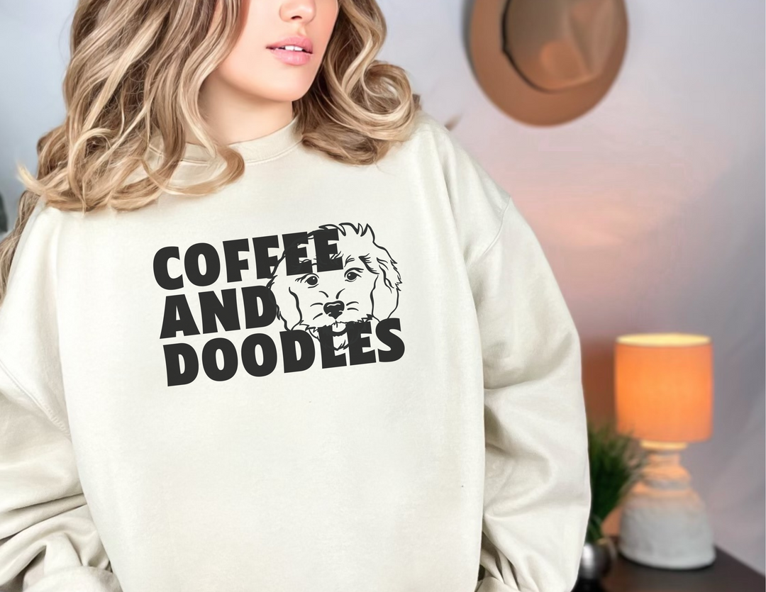 A cozy Doodles and Coffee Crewneck sweatshirt, a blend of polyester and cotton, featuring a ribbed knit collar and no itchy side seams. Unisex, loose fit, medium-heavy fabric. Sewn-in label, true to size.