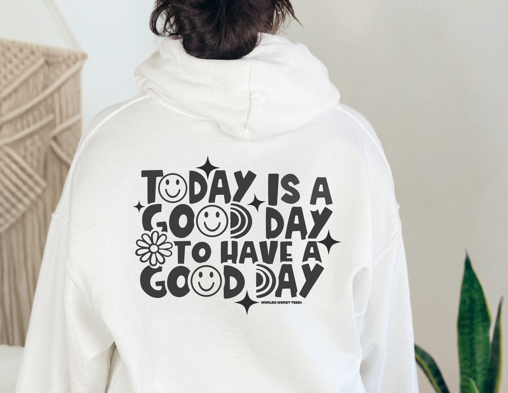 Unisex heavy blend hooded sweatshirt with kangaroo pocket, no side seams, and drawstring hood. Features GOOD DAY TO HAVE A GOOD DAY print. Cotton/polyester blend, medium-heavy fabric, classic fit. Sizes S-5XL.