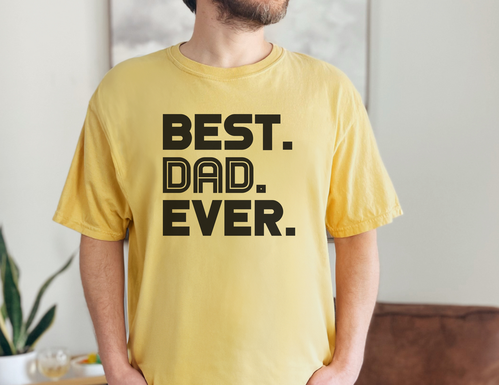 A premium Best Dad Ever Tee in yellow, XS-4XL sizes. Comfy, light, ribbed knit collar, roomy fit, 100% cotton, side seams for shape support. Ideal for workouts or daily wear.