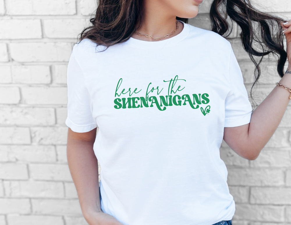 A classic unisex jersey tee featuring the Here for the Shenanigans design. Soft cotton, ribbed collar, and shoulder taping for a comfortable fit. Retail fit, 100% cotton.