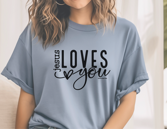 A relaxed fit Jesus Loves You Tee, made of 100% ring-spun cotton for extra coziness. Garment-dyed with double-needle stitching for durability and a seamless look. Ideal for daily wear.