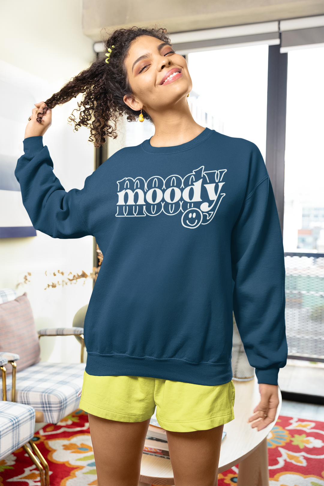A unisex heavy blend crewneck sweatshirt, the Moody Crew, offers comfort with ribbed knit collar, no itchy seams, and a loose fit. Made of 50% cotton and 50% polyester, medium-heavy fabric.