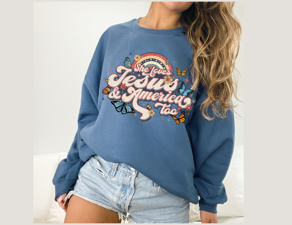 A unisex heavy blend crewneck sweatshirt featuring She Loves Jesus and America design. Made of 50% cotton and 50% polyester, with ribbed knit collar and no itchy side seams. Comfortable and stylish.