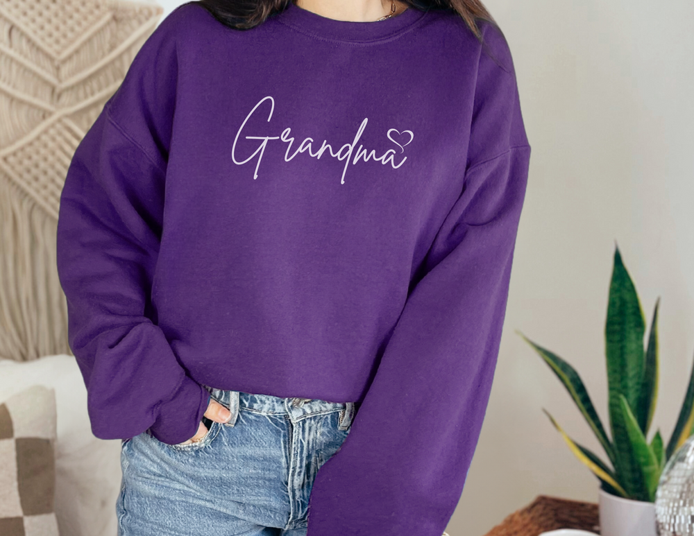 A cozy Grandma Love Crew unisex sweatshirt in heavy blend fabric, featuring a ribbed knit collar and no itchy side seams. Made of 50% cotton and 50% polyester, with a loose fit and true-to-size.