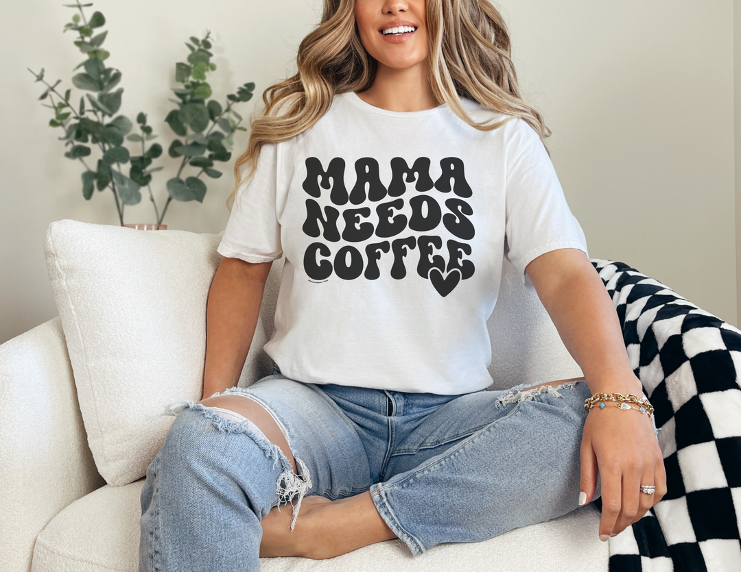 A relaxed fit Mama Needs Coffee Tee, crafted from 100% ring-spun cotton for comfort. Garment-dyed with double-needle stitching for durability and a tubular shape. Perfect for daily wear.