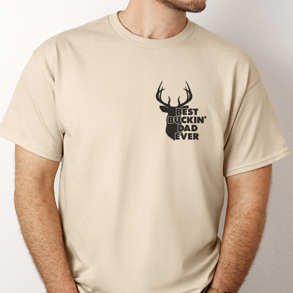 A premium Best Buckin' Dad Ever Tee for men, featuring a deer head silhouette on a comfy, light fabric with ribbed knit collar and roomy fit. Ideal for workouts or everyday wear.