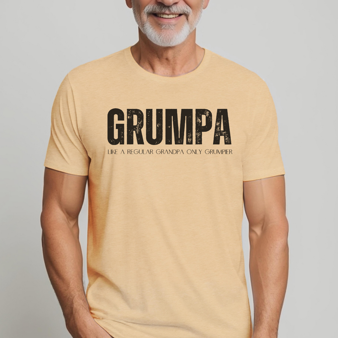 Grumpa Tee: A man in a yellow shirt, close-up of mouth, wearing a relaxed-fit garment-dyed t-shirt. 100% ring-spun cotton, durable double-needle stitching, no side-seams for tubular shape.