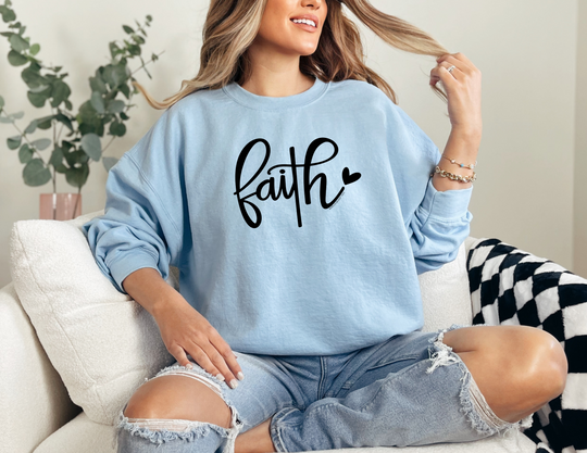 Unisex Faith Crew sweatshirt in garment-dyed fleece, featuring a relaxed fit, rolled-forward shoulder, and back neck patch. Made of 80% ring-spun cotton and 20% polyester. Sizes S to 3XL.