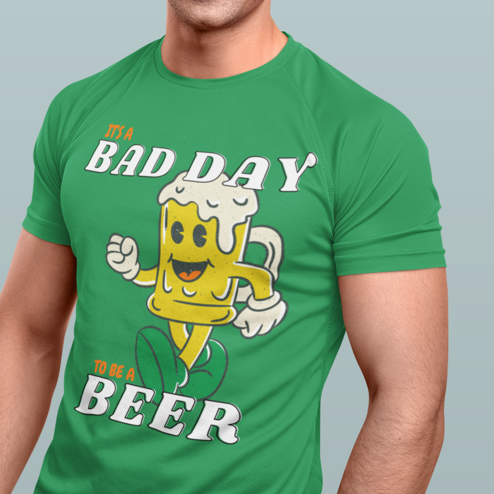 A relaxed fit, garment-dyed t-shirt featuring a cartoon beer mug graphic. Made of 100% ring-spun cotton for coziness and durability. From Worlds Worst Tees, known for unique graphic t-shirts.