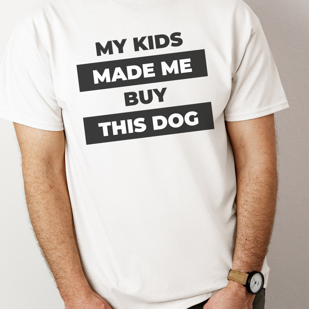 Unisex Kids Made Me Buy Tee, a staple tee with no side seams for comfort. Ribbed knit collar, durable shoulders, medium weight fabric. Classic fit. 100% cotton. From Worlds Worst Tees.