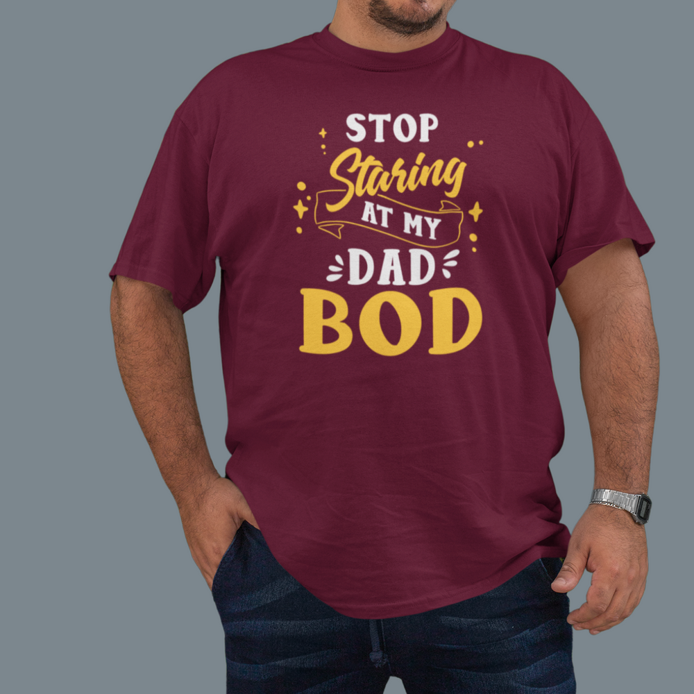 A premium fitted men's short sleeve tee, Stop Staring at My Dad Bod, in red. Comfy, light, ribbed knit collar, side seams for shape, 100% cotton. From 'Worlds Worst Tees'.
