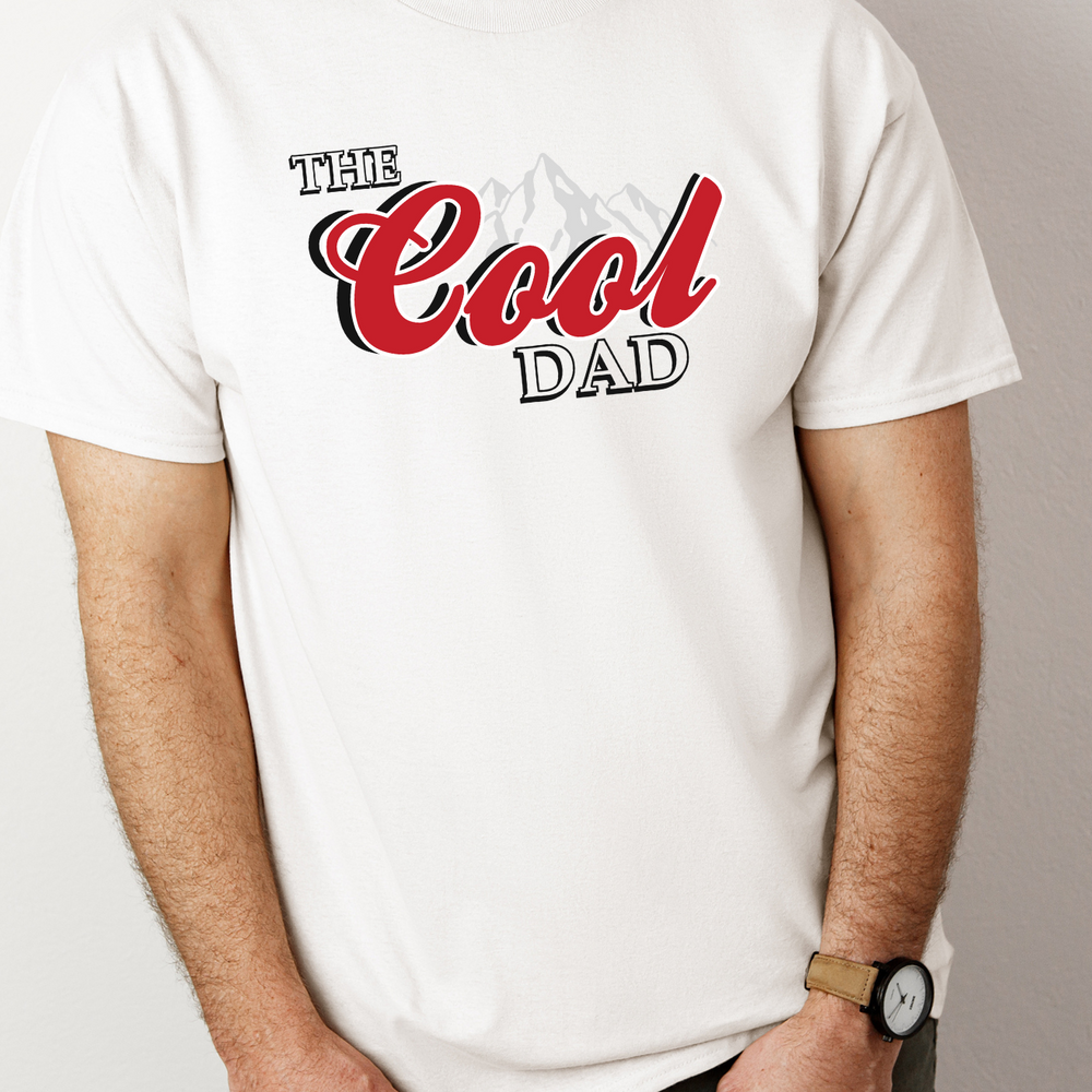A relaxed fit, garment-dyed tee crafted from 100% ring-spun cotton. Features double-needle stitching for durability and a seamless design for a tubular shape. From Worlds Worst Tees, The Cool Dad Tee.