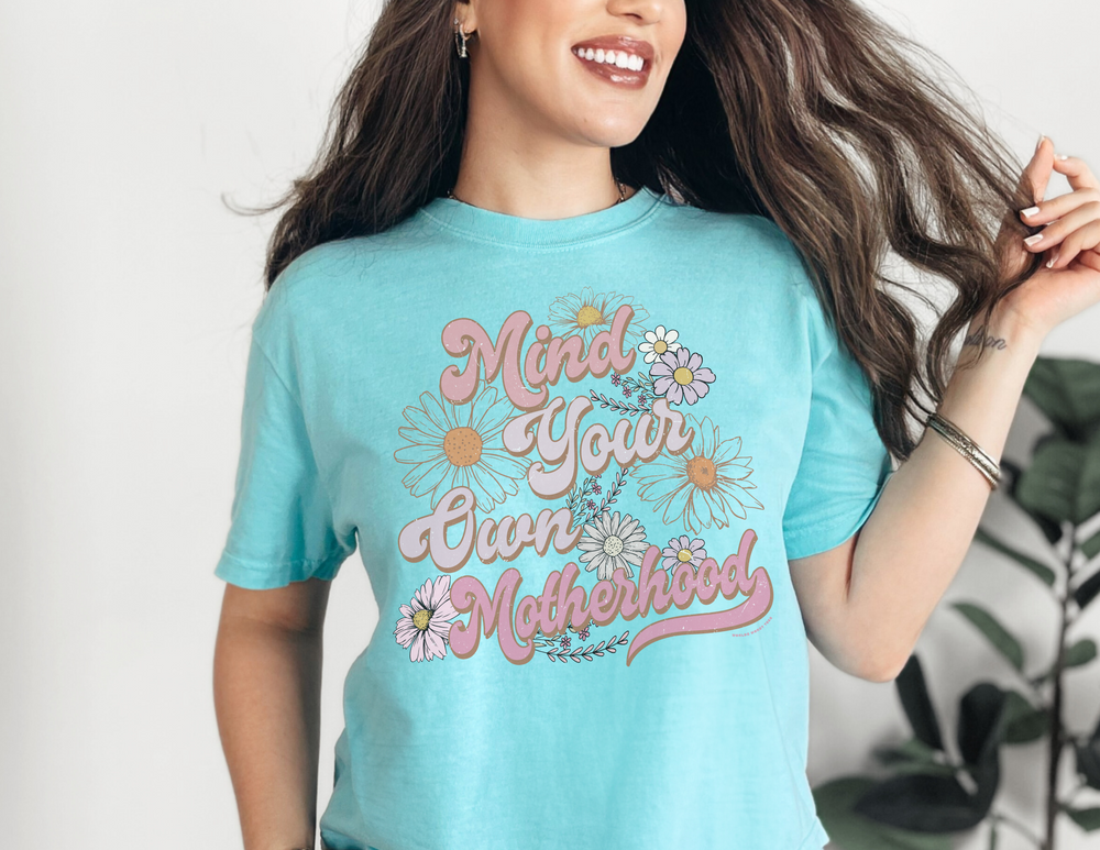 A relaxed fit Mind Your Motherhood Tee, crafted from 100% ring-spun cotton for ultimate comfort. Garment-dyed with double-needle stitching for durability and a seamless design. Ideal for daily wear.