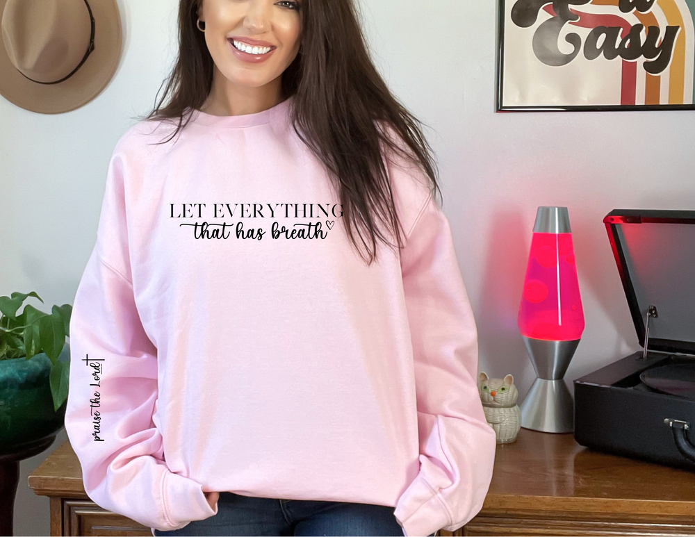 A unisex heavy blend crewneck sweatshirt featuring the Let Everything That Has Breath Praise the Lord Crew design. Made of 50% cotton and 50% polyester for comfort and durability. Double-needle stitching for longevity.