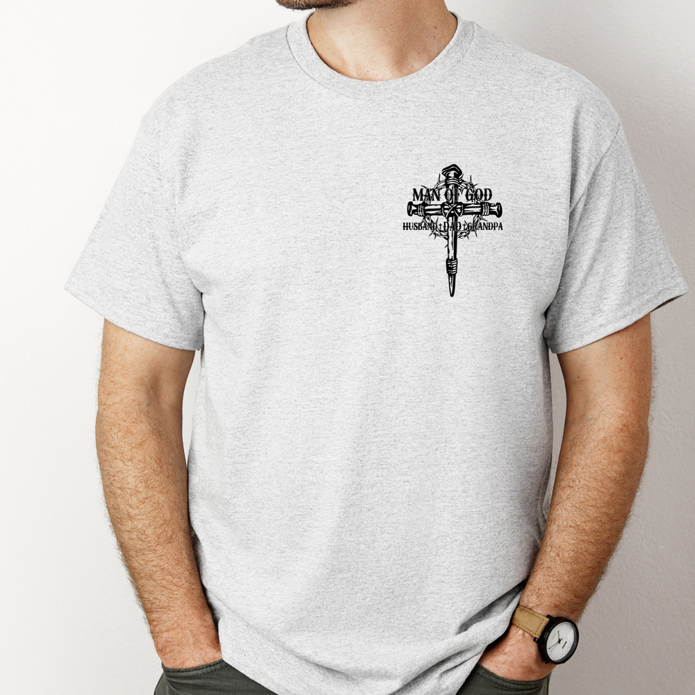 A relaxed fit Man of God Husband Dad Grandpa Tee in white, featuring a cross with a crown of thorns design. Made of 100% ring-spun cotton, with double-needle stitching for durability.