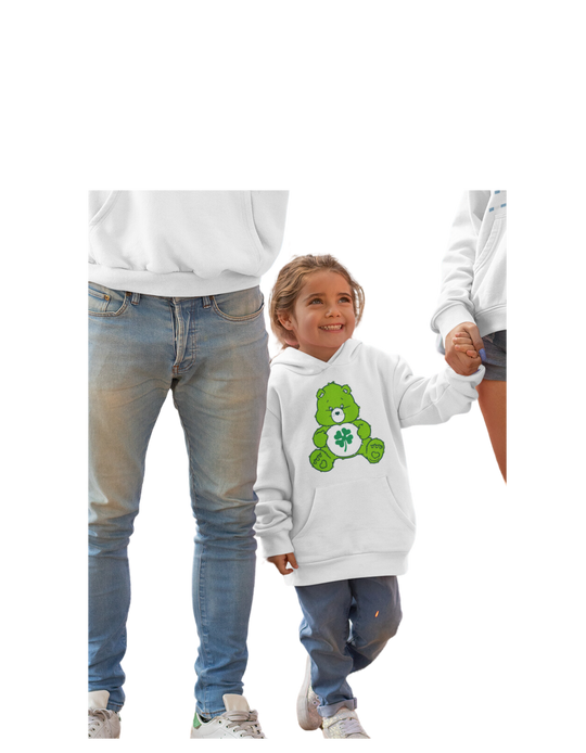 A Lucky Bear Youth Hoodie featuring a green teddy bear on a child holding hands with an adult. Made of soft cotton-polyester blend with kangaroo pocket and twill taping. Ideal for kids.