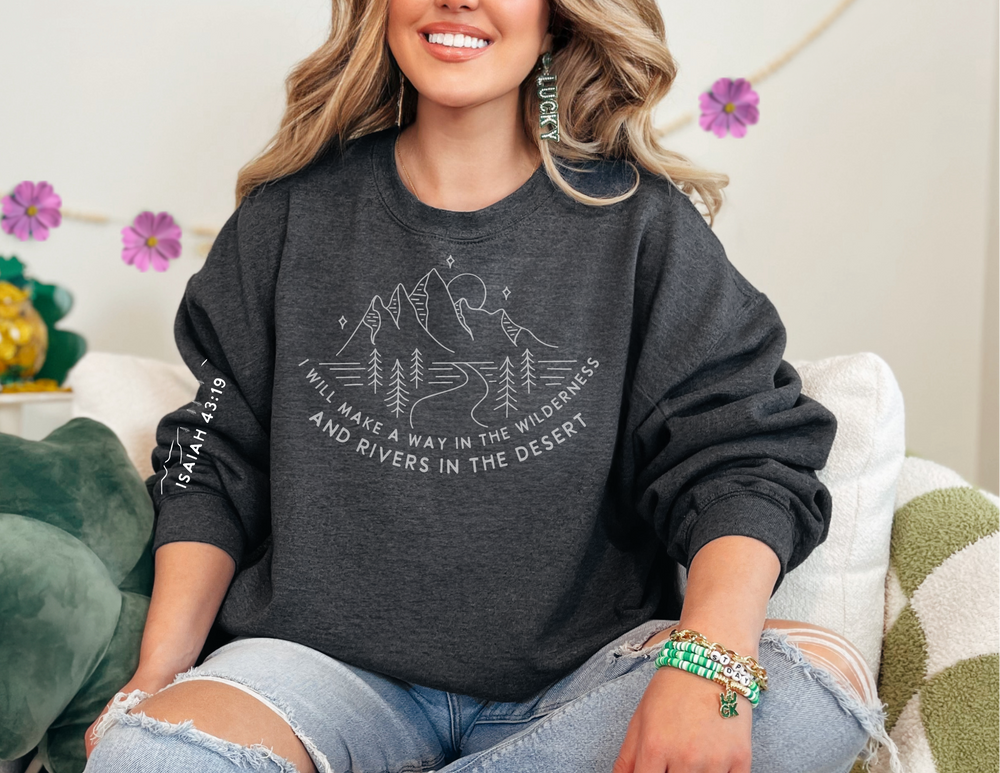 A woman in a cozy unisex heavy blend crewneck sweatshirt, featuring a ribbed knit collar for shape retention. Made from 50% cotton and 50% polyester for comfort and durability.
