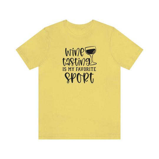 A Wine My Favorite Sport Tee, a yellow shirt with black text, featuring a classic unisex jersey fit in soft cotton. Ribbed knit collars, taping on shoulders, and dual side seams for durability.