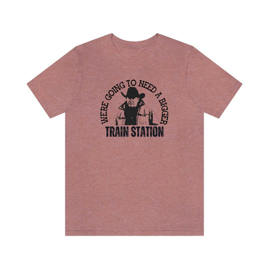 Fitted men’s tee, We're Going to Need a Bigger Train Station, featuring a cowboy graphic. Combed cotton, ribbed collar, roomy fit. Ideal for workouts or daily wear. From Worlds Worst Tees.